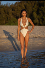 White one piece with cut outs
